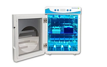 Open UVClave™ chamber with UV-C bulbs switched on