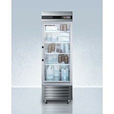 Upright refrigerator with closed glass panel door filled with bottles and boxes inside