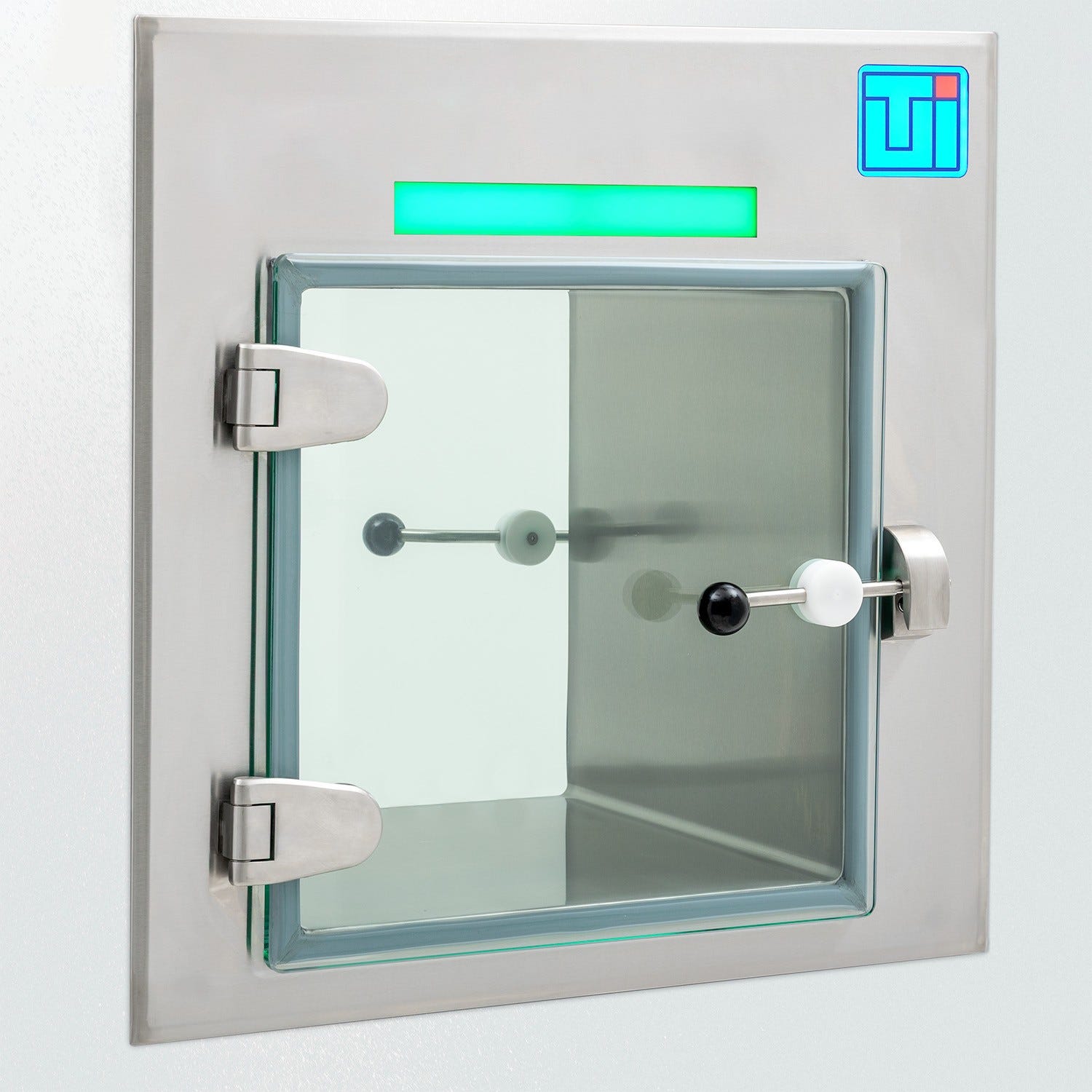 Photo of a smart stainless steel pass-through with a frameless glass door