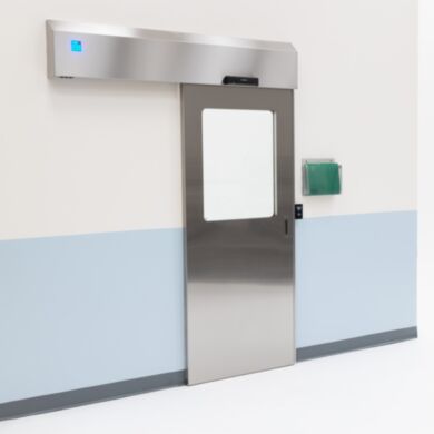 Partial view stainless steel automatic sliding door with touchless motion door pad  |  5556-13-LS displayed