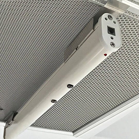 Ionizing bar, shown mounted to cleanroom ceiling fan/fitler unit, neutralizes surface charges to prevent electro-static discharge (ESD)