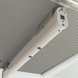 Ionizing bar, shown mounted to cleanroom ceiling fan/fitler unit, neutralizes surface charges to prevent electro-static discharge (ESD)