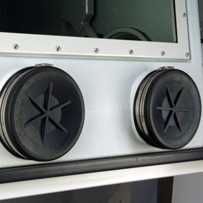 Shown are exterior glove port covers placed over gloveports on a Labconco glovebox. | 3643-51 displayed
