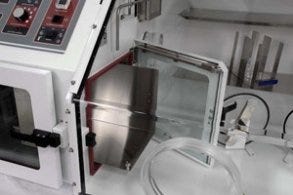 Airlock in a low-oxygen glovebox allows passage of samples and supplies without compromising the internal environment.