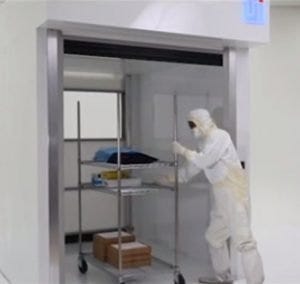 High-speed roll-up door for transferring personnel or large equipment into ISO-rated rooms